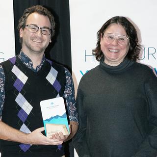 Chris Yeast receives the award for Service Excellence from VIU President Deb Saucier